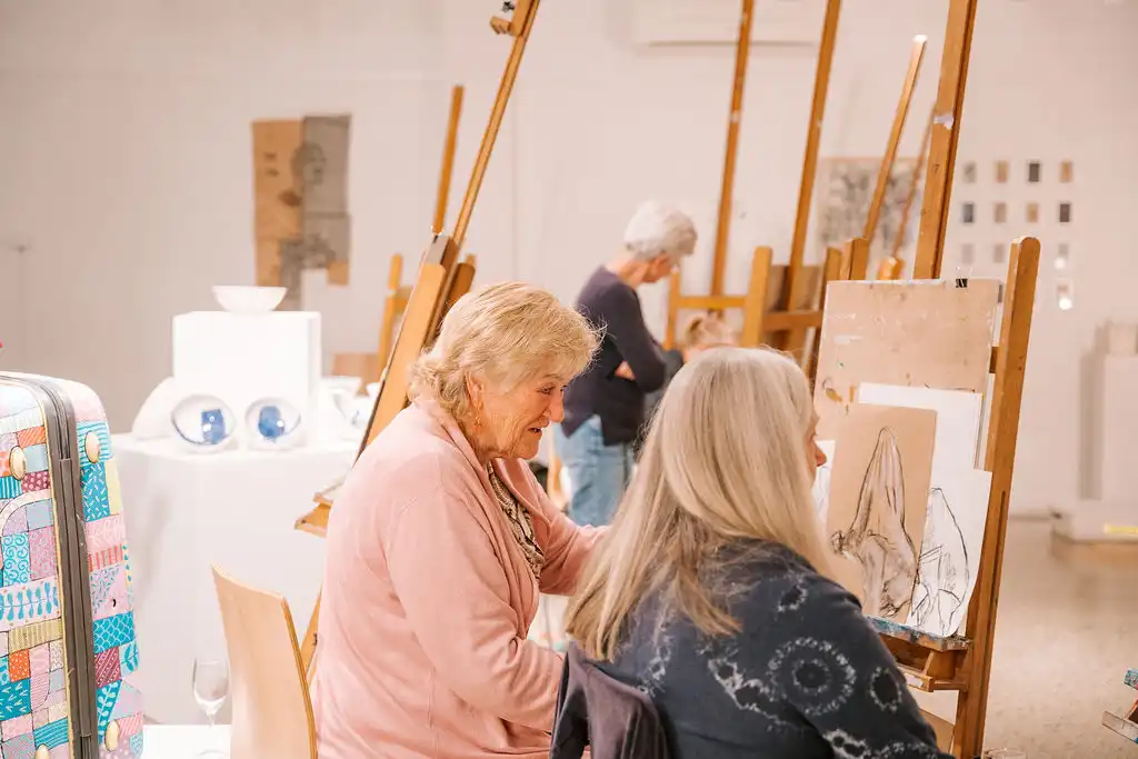 People in studio sketching.